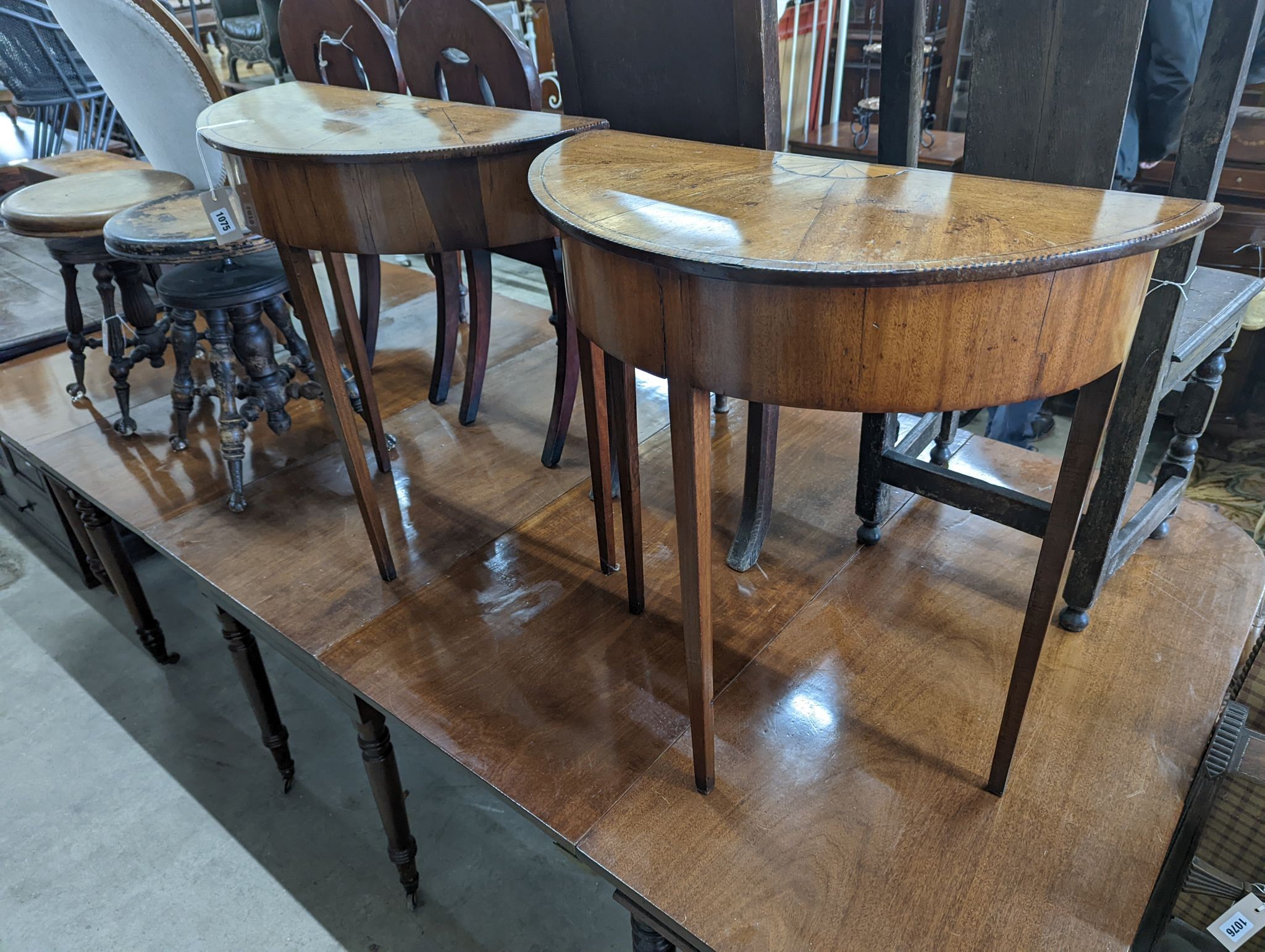 A pair of George III style inlaid mahogany D shaped side tables, width 64cm, depth 32cm, height 71cm